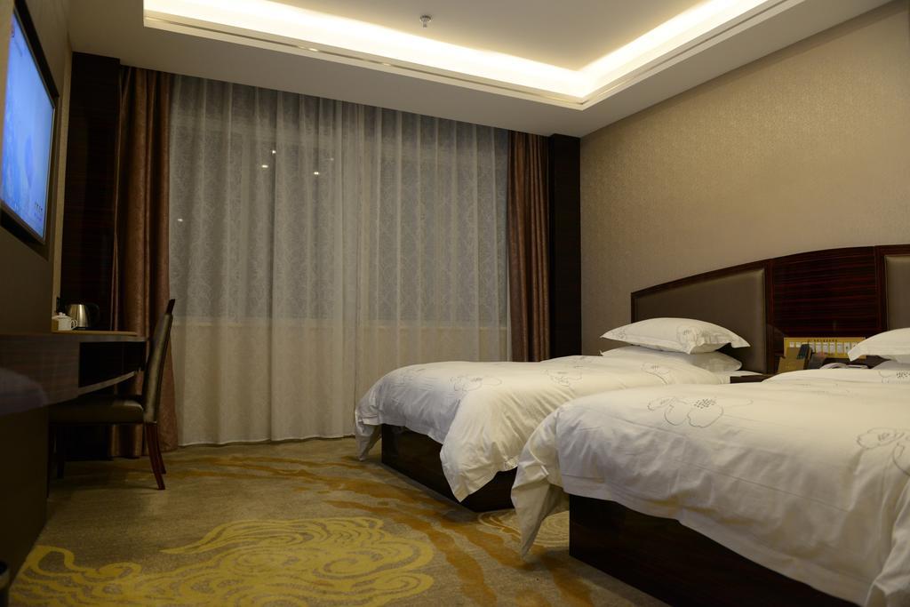 Tie Cheng Hotel Guangzhou Rum bild